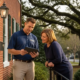 Painting consultant reviewing an estimate on a tablet with a homeowner