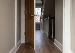 Freshly painted baseboard, casing and interior door edge in a Kingstowne townhouse